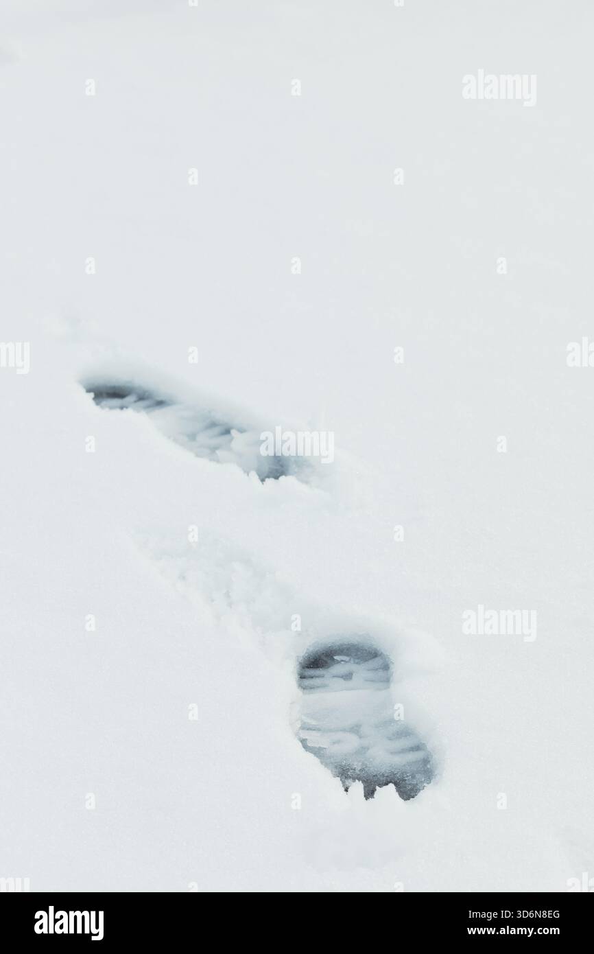 Fresh snow showing boot prints in winter Stock Photo