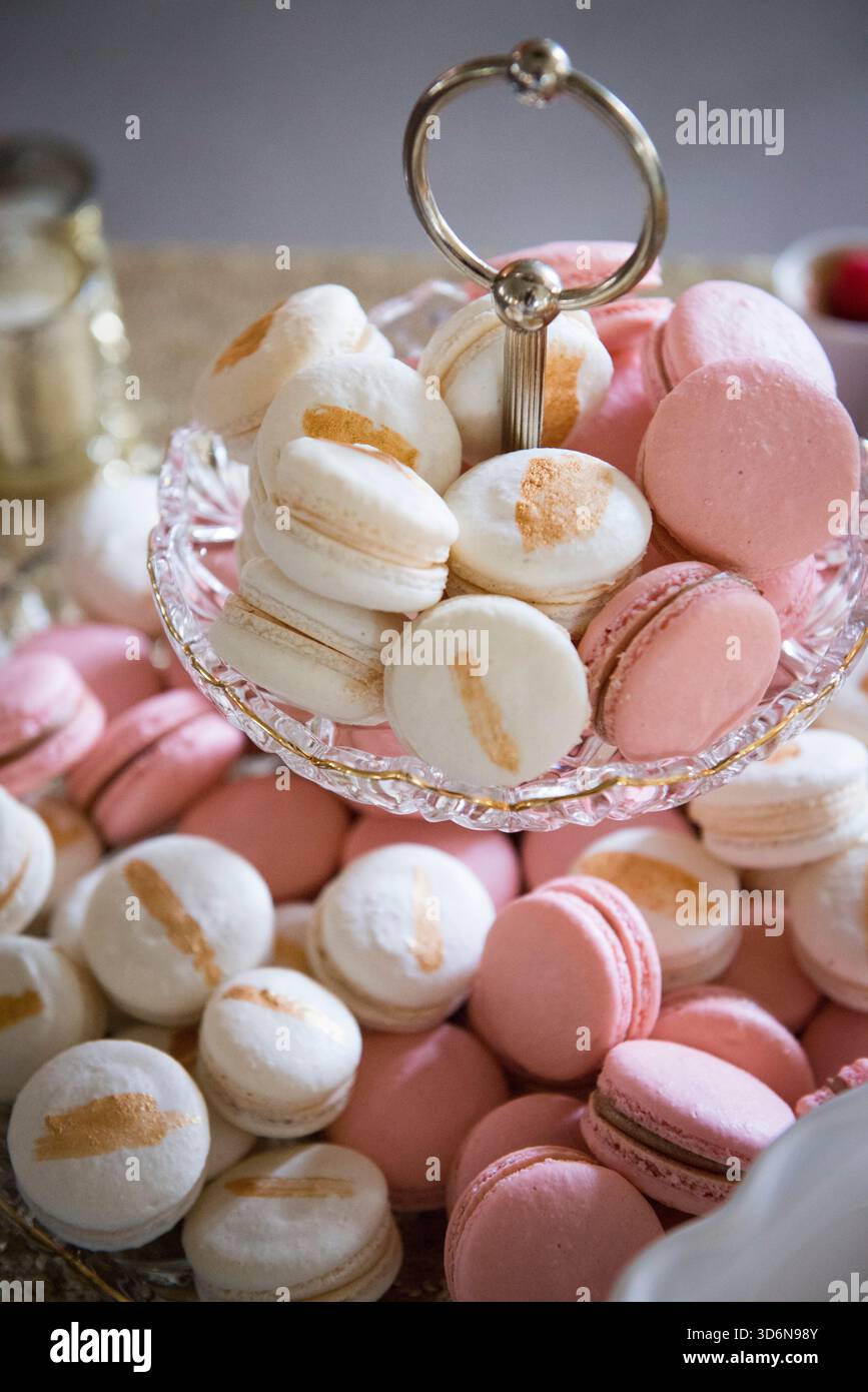 Elegant Pink and White Macarons on Glass Serving Tray Stock Photo