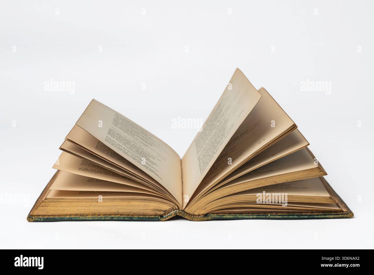Antiquarian book open on a white surface Stock Photo