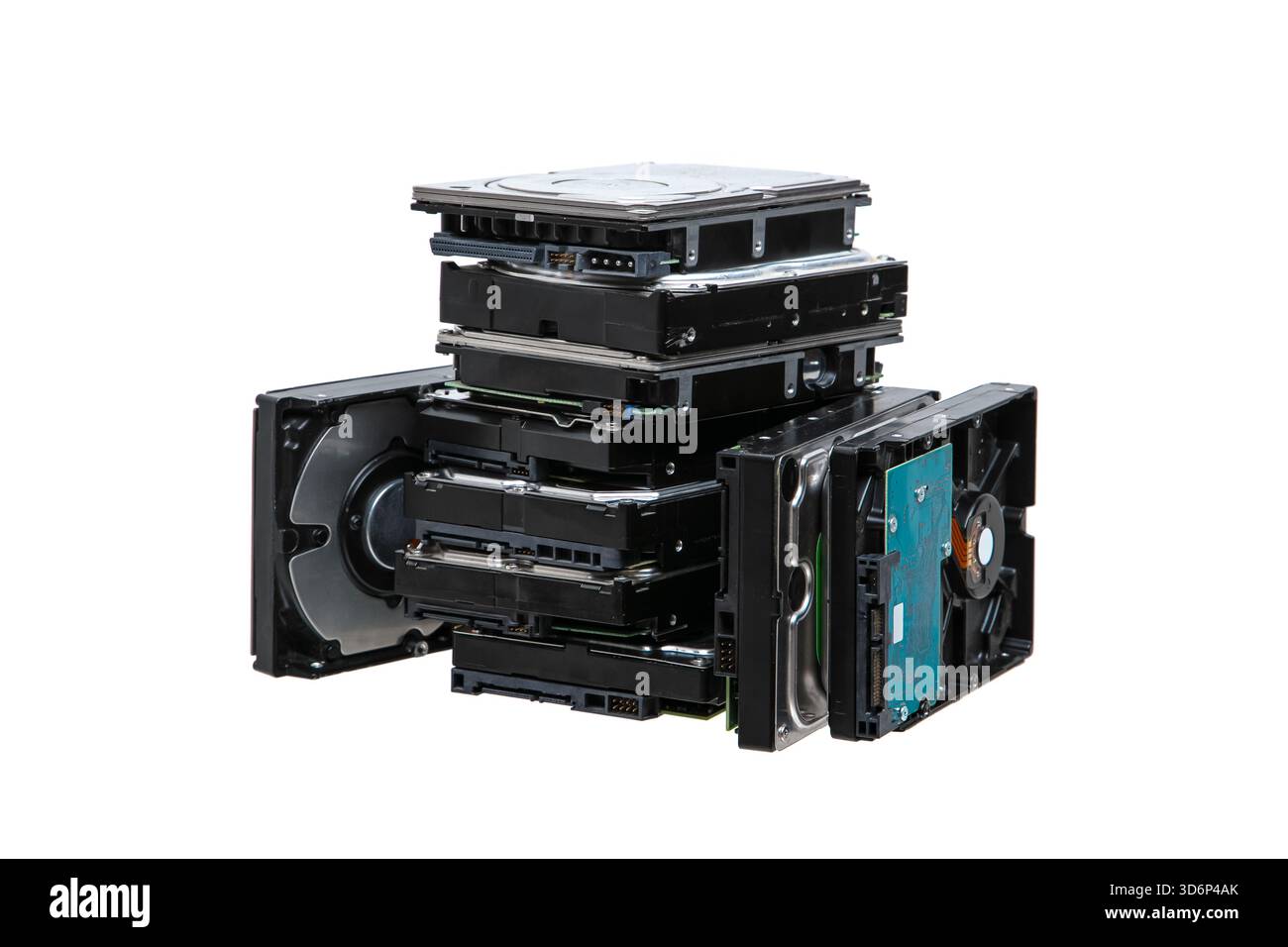 A large stack, pile  of internal computer hard disk drives, HDDs, isolated on a white background. Stock Photo