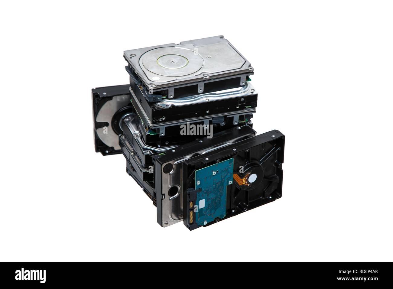 A large stack, pile  of internal computer hard disk drives, HDDs, isolated on a white background. Stock Photo