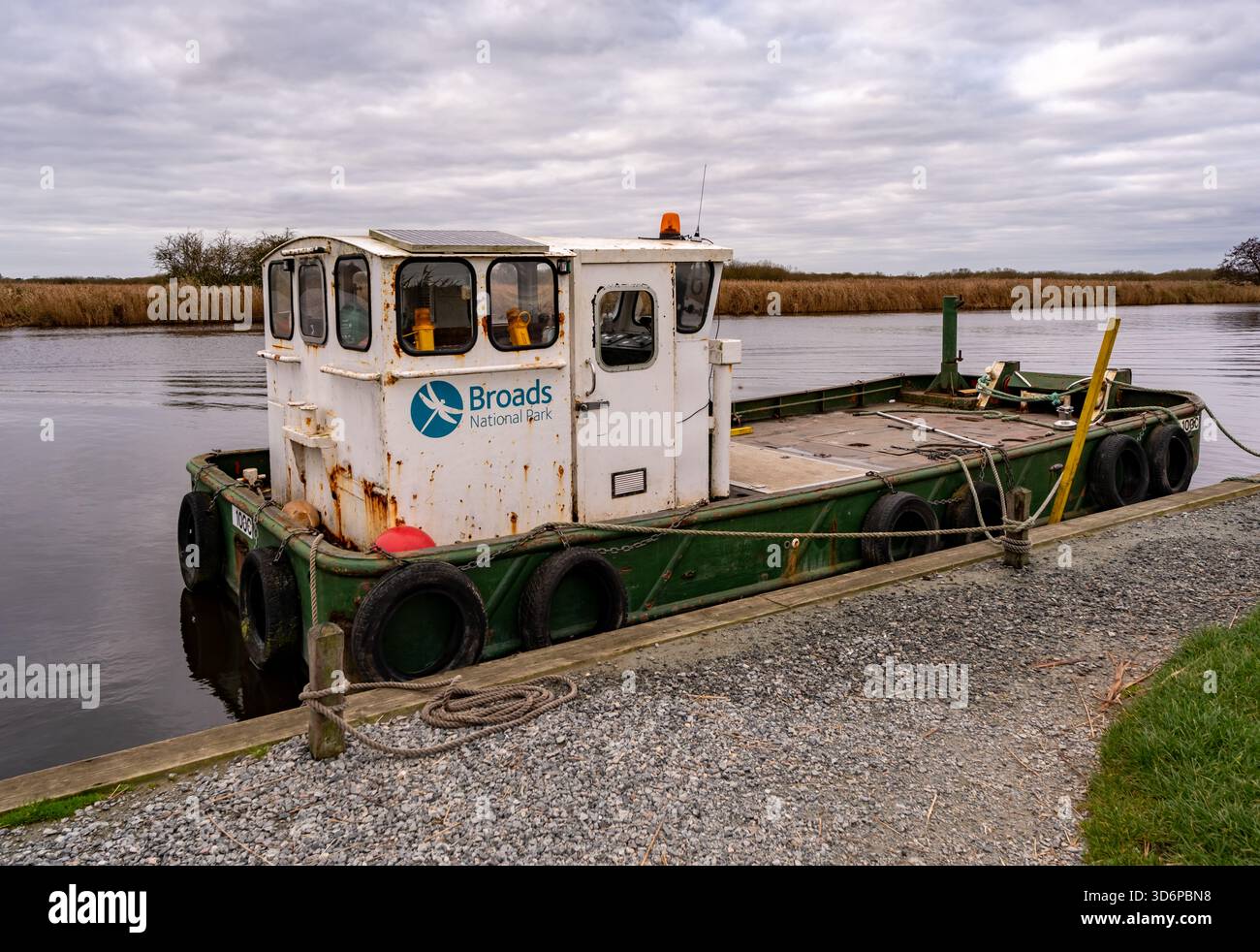 Rusty Broads Ranger boat tied up and moored to the jetty on the River ...