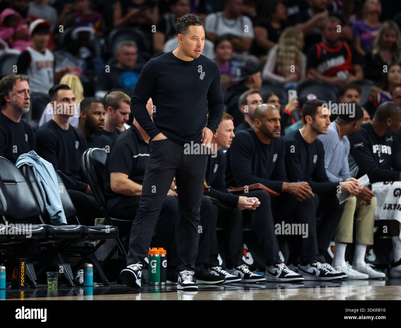 San Antonio Spurs head coach Mitch Johnson looks on during the second