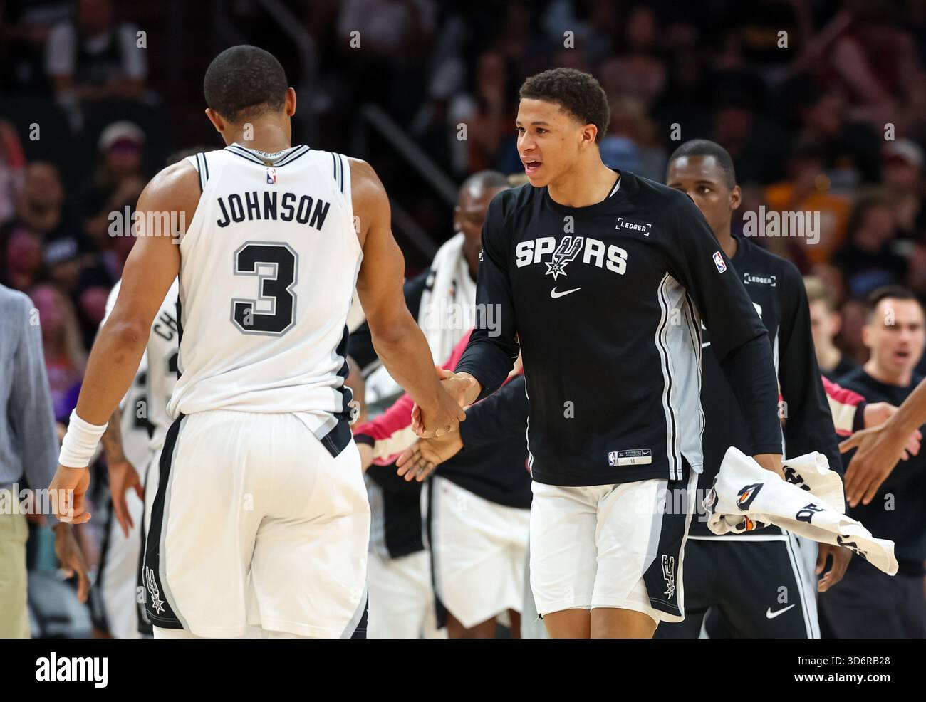San Antonio Spurs forward Carter Bryant (11) greets forward Keldon ...