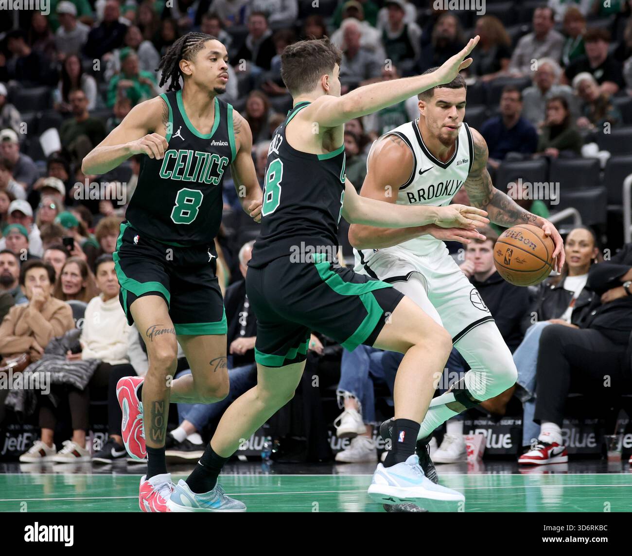 Brooklyn Nets forward Michael Porter Jr., right, dribbles past Boston ...