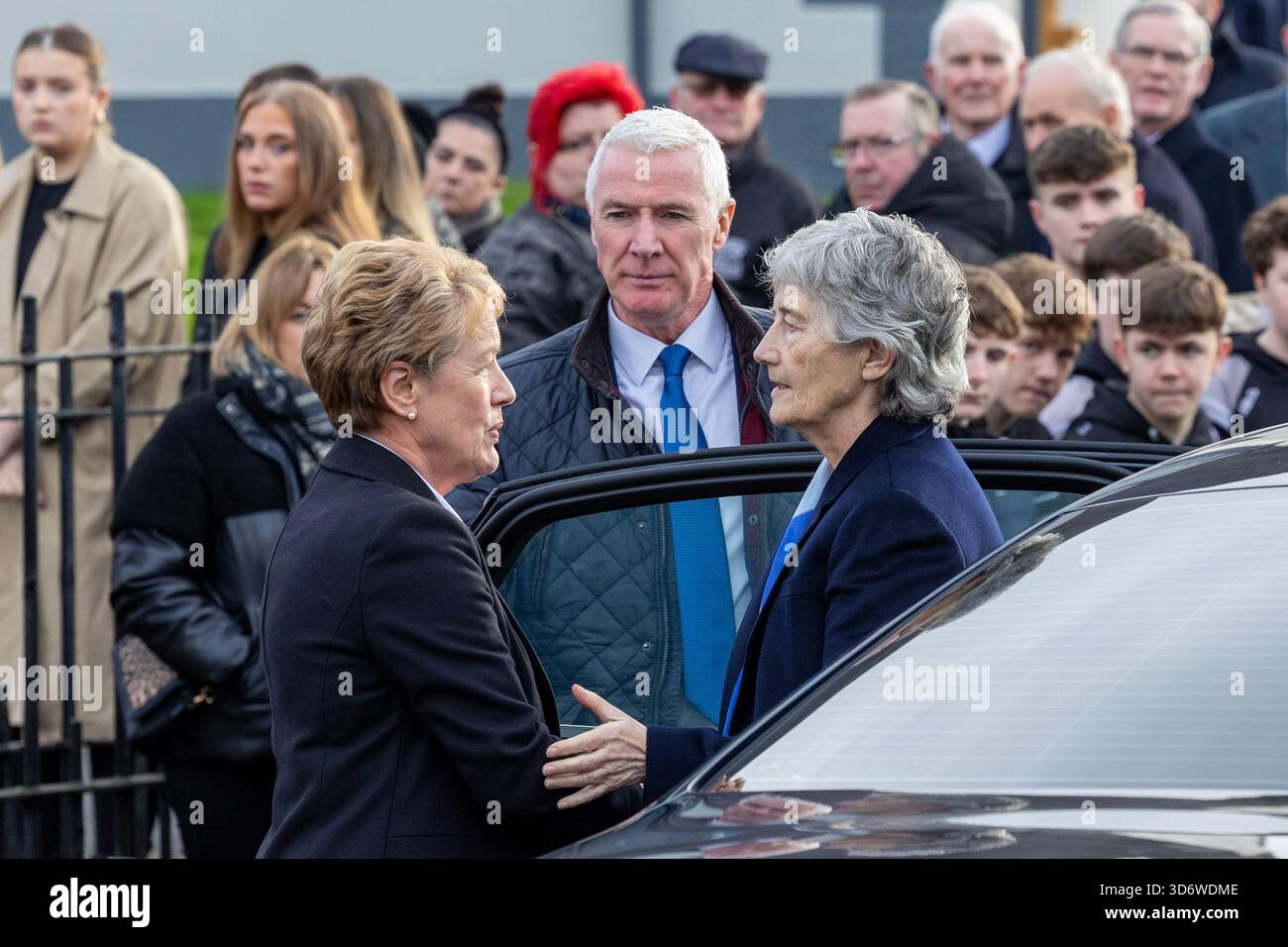 President Catherine Connolly is welcomed by Rita Metzer, a member of ...