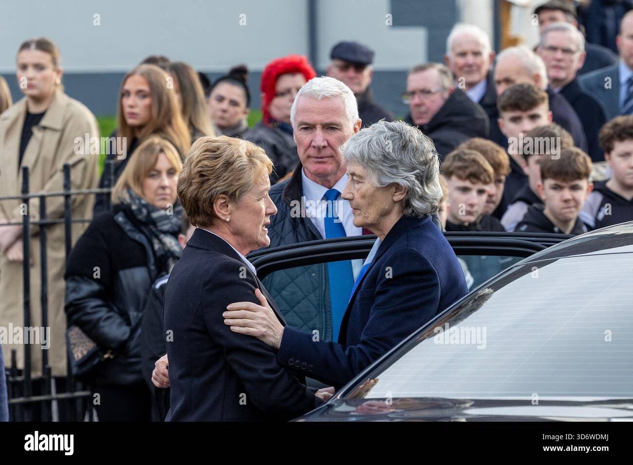 President Catherine Connolly is welcomed by Rita Metzer, a member of ...