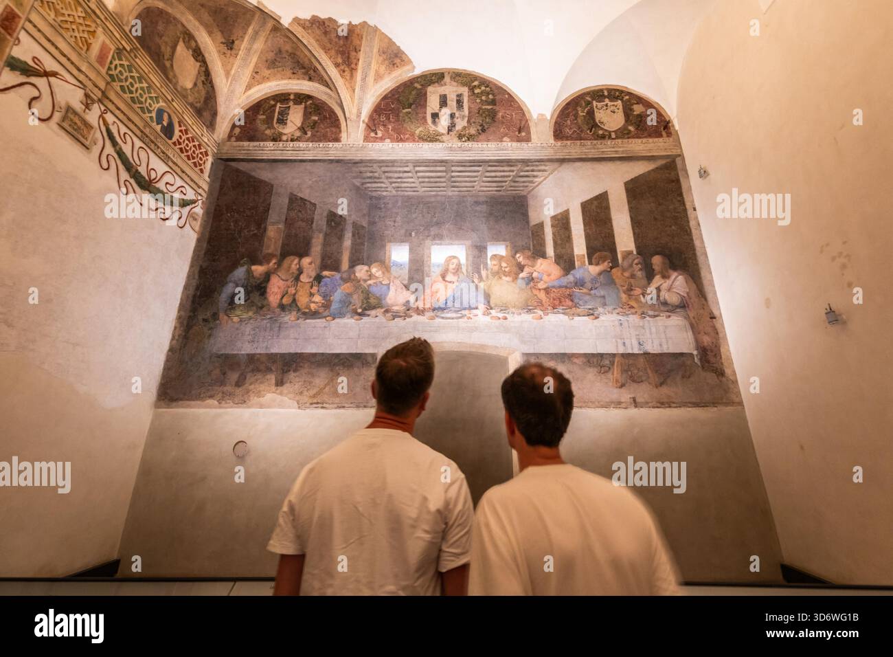 MILAN, ITALY ? AUGUST 2025: Two visitors stand in front of Leonardo da ...