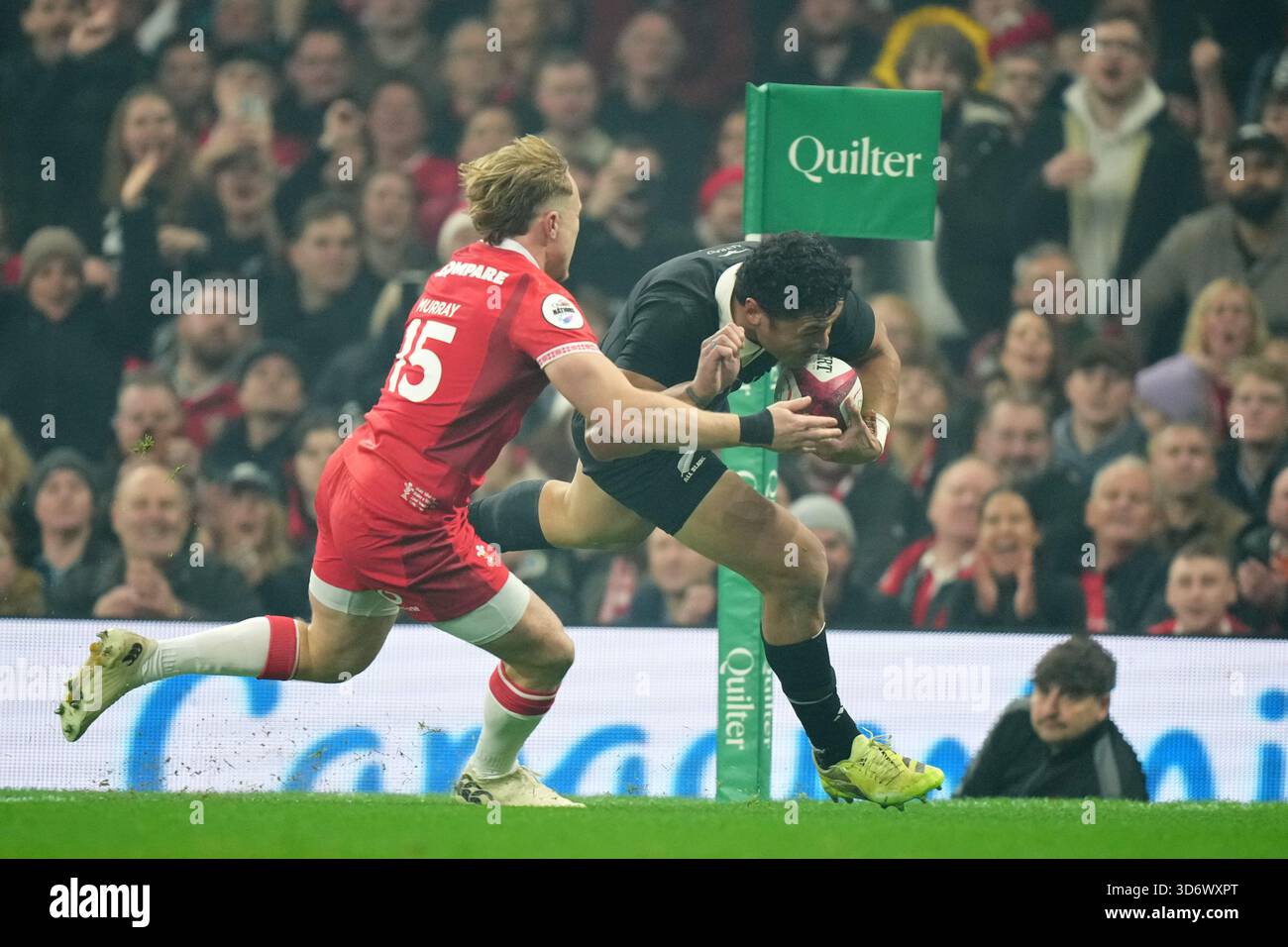New Zealand's Caleb Clarke, right, gets past Wales' Blair Murray to ...