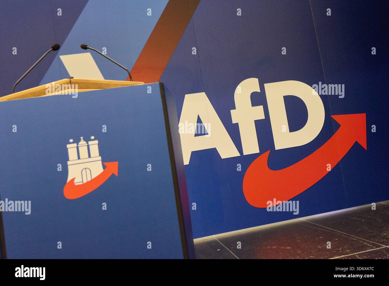 22 November 2025, Hamburg: The AfD logo can be seen behind the lectern ...