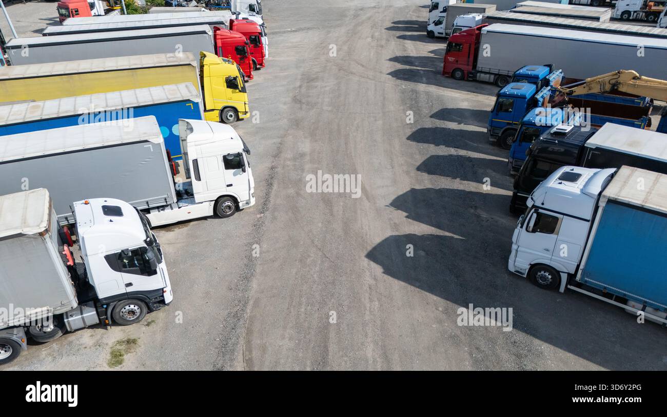 Aerial view of a large truck parking lot at a logistics hub, with ...