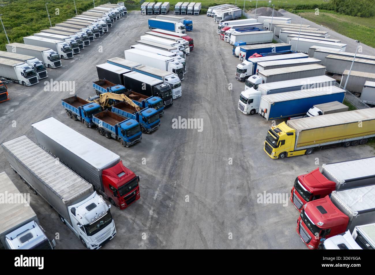 Aerial view of a large truck parking lot at a logistics hub, with ...