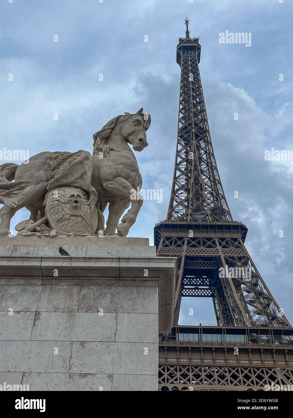 Eiffel Tower Framed by Classical Stone Sculpture in Paris - Smartphone Captured Stock Image