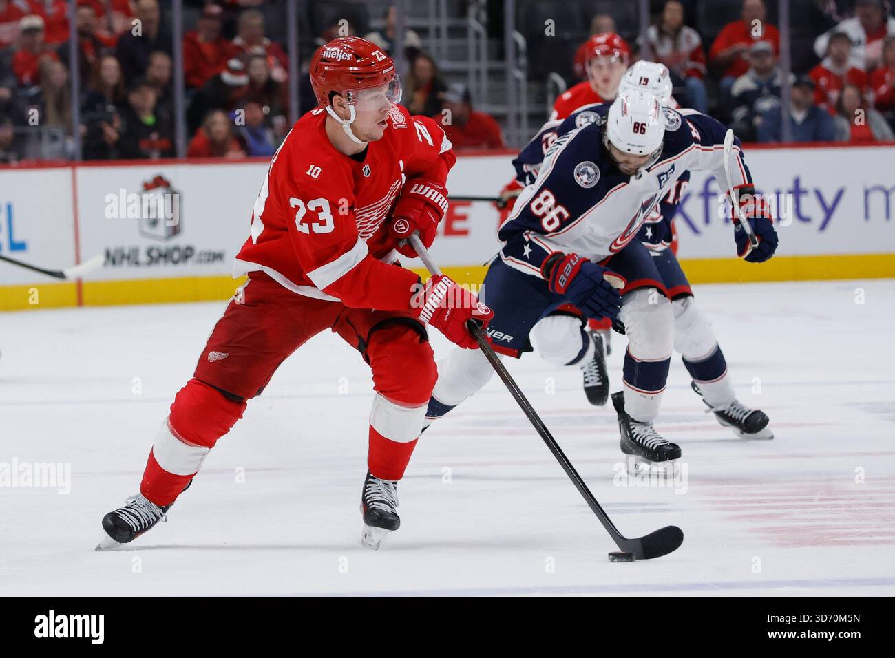 Marchenko 86 Detroit Red Wings left wing Lucas Raymond (23) is pursued up the ice by ...