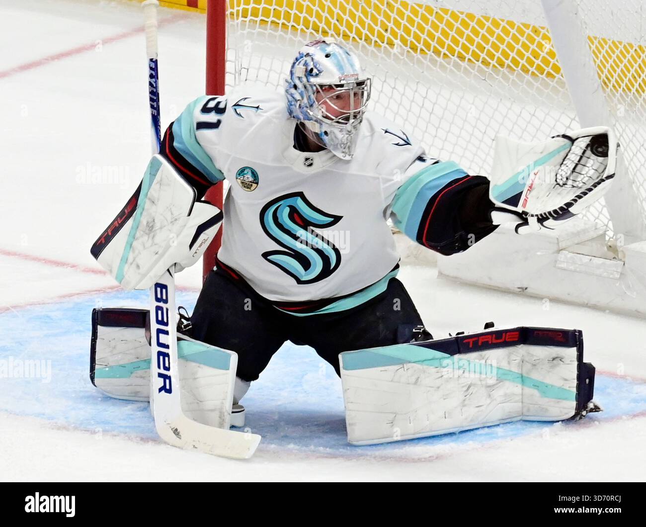 Seattle Kraken goaltender Philipp Grubauer (31) makes a glove save ...