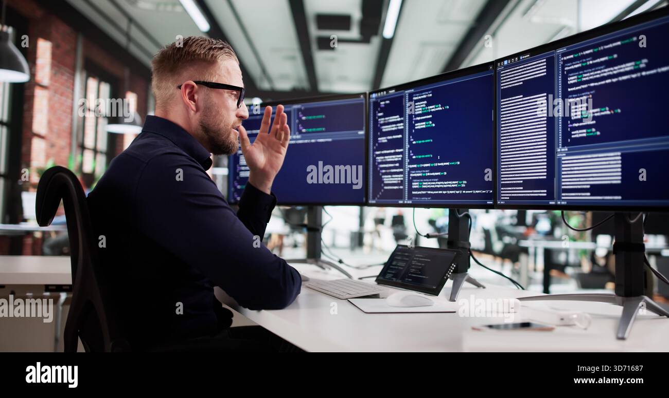 The Frustrated Web Developer At His Boring Desk Job. Stock Photo