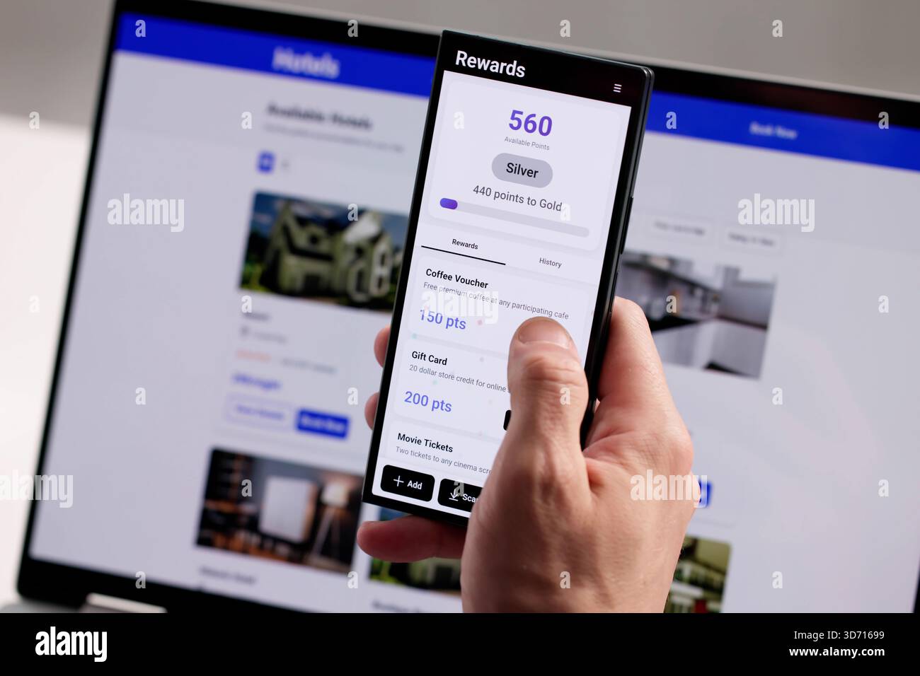 Man Earns Loyalty Points Using Smartphone App For Retail Rewards. Stock Photo