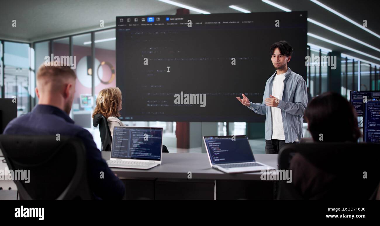 Web Software Developers Meet In Classroom For Late Night Meeting Stock Photo