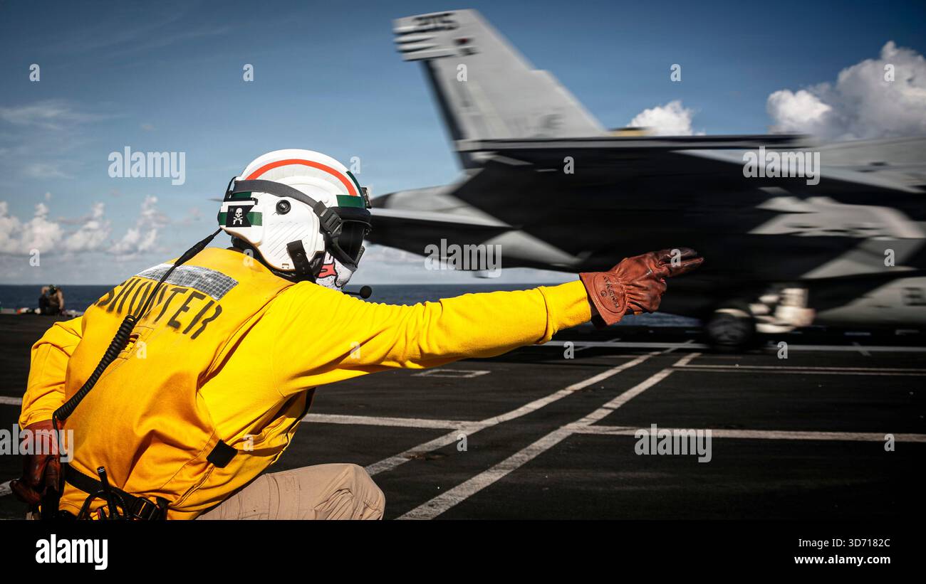 A U.S. Sailor aboard the world's largest aircraft carrier, Ford-class ...