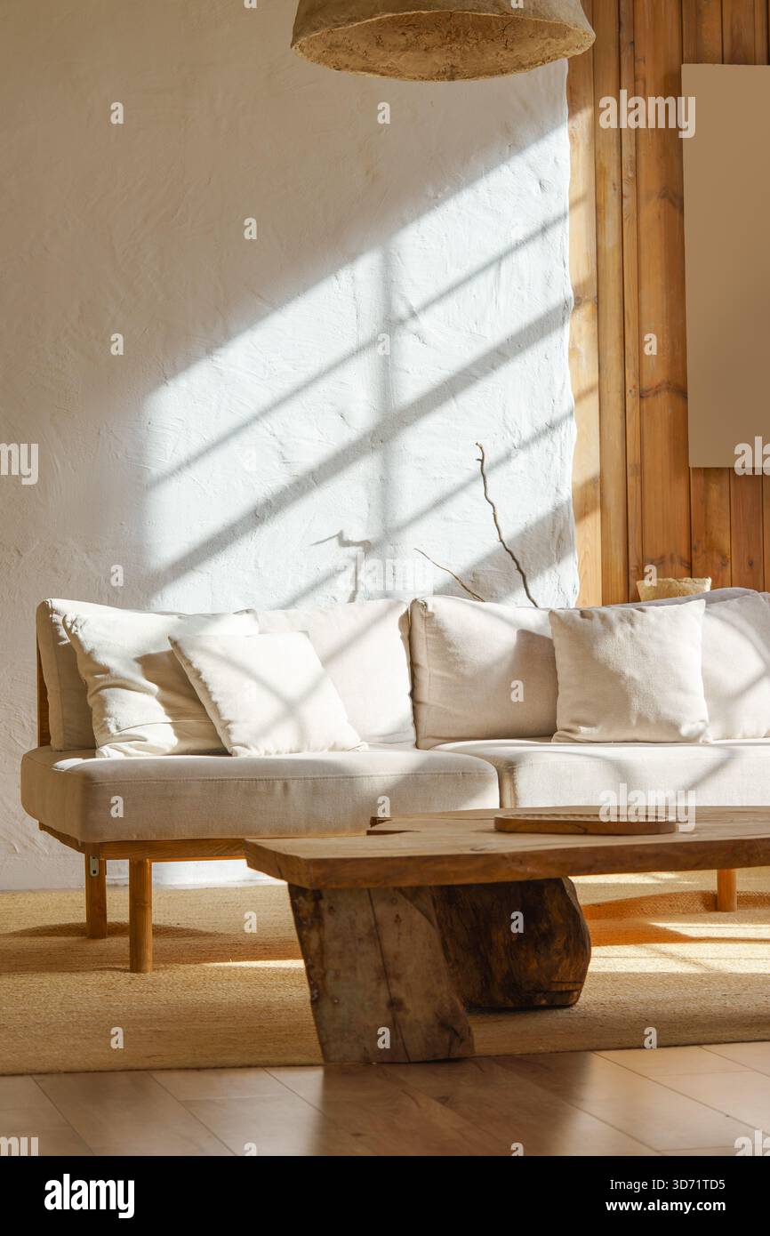 Bright cozy living room with light beige sofa, rustic wooden coffee ...