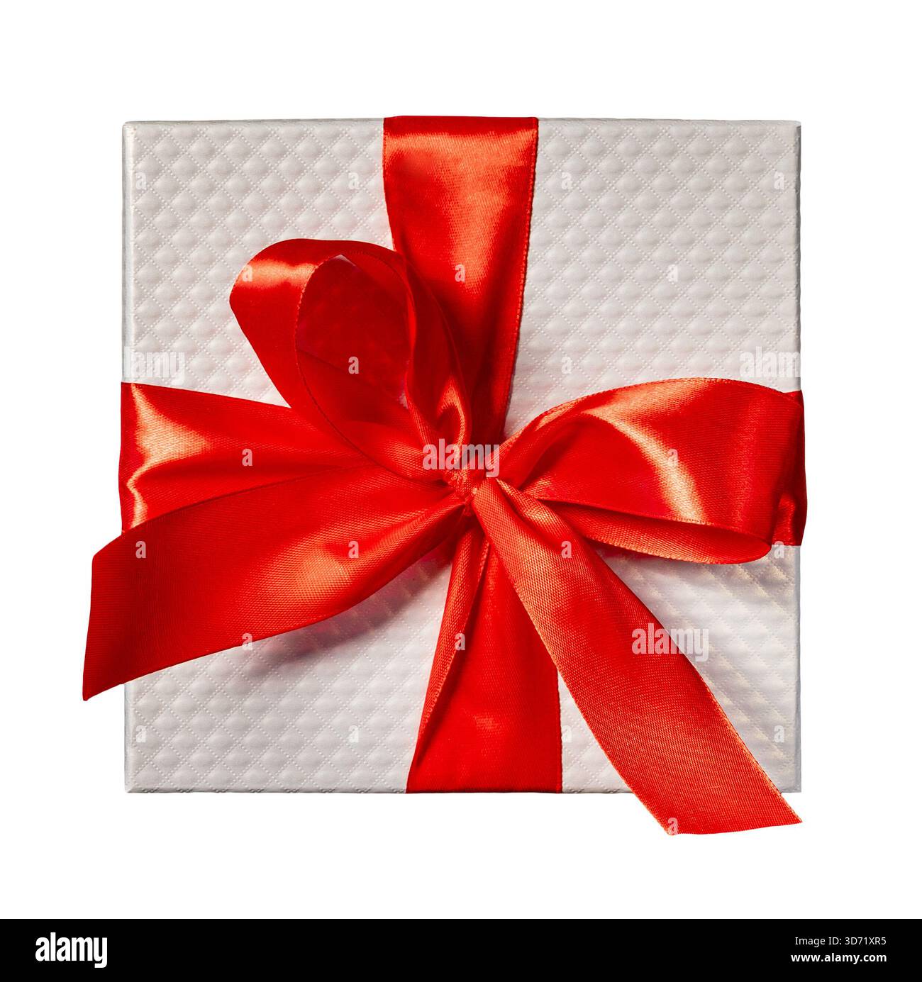 White gift box wrapped in red ribbon with big bow. Stock Photo