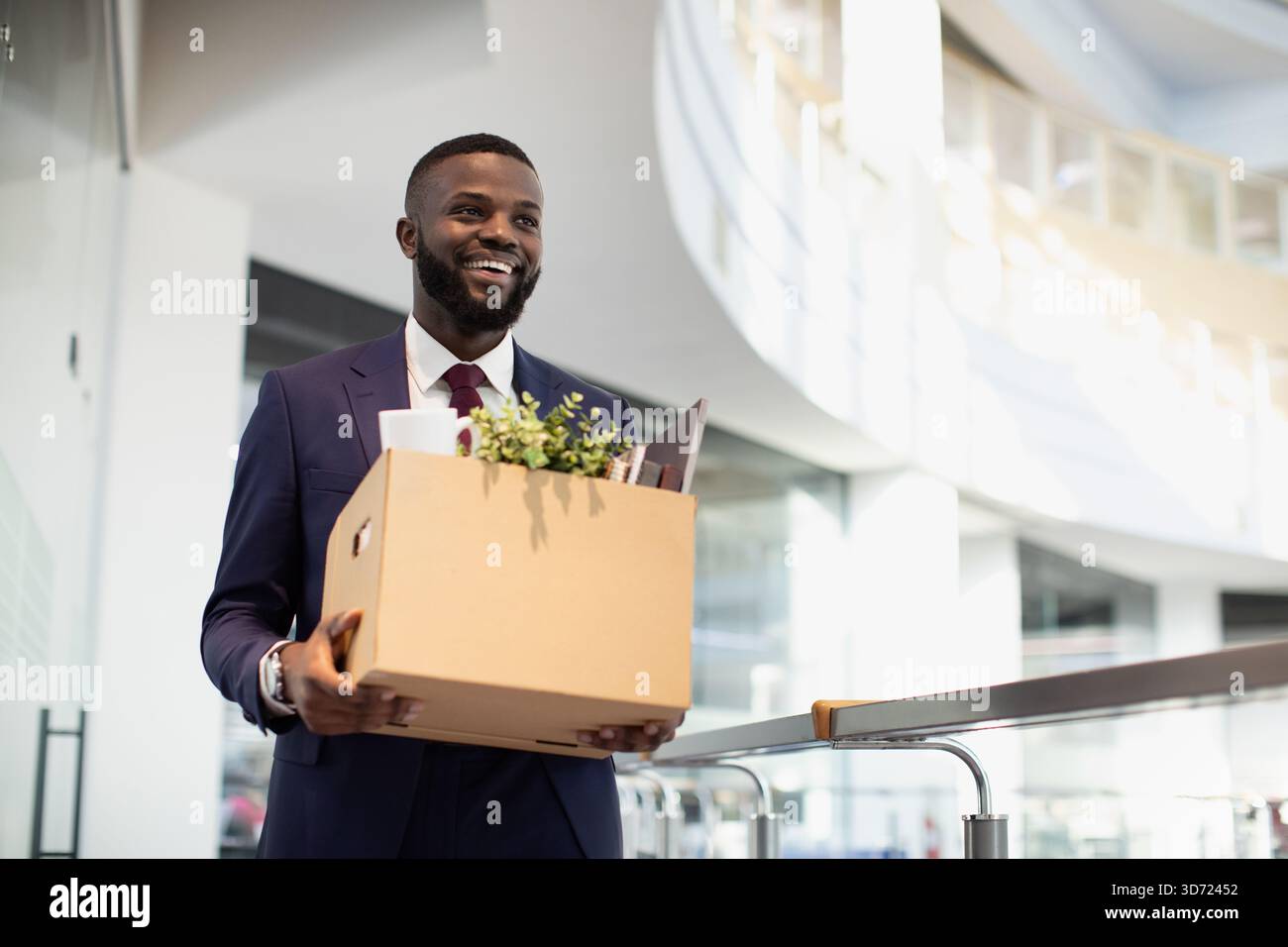 Happy african american young man with working stuff Stock Photo
