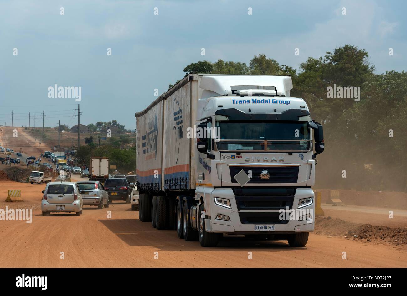 Lilongwe Malawi Africa. 08.11.2025.  Articulated  Zambian truck on a dirt road in  Lilongwe capital of Malawi Africa. - Stock Image