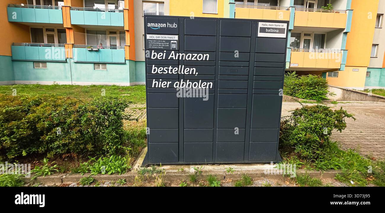 Berlin, Germany - July 14, 2025: Amazon Hub package locker is located in a residential area with greenery around. - Smartphone Captured Stock Image