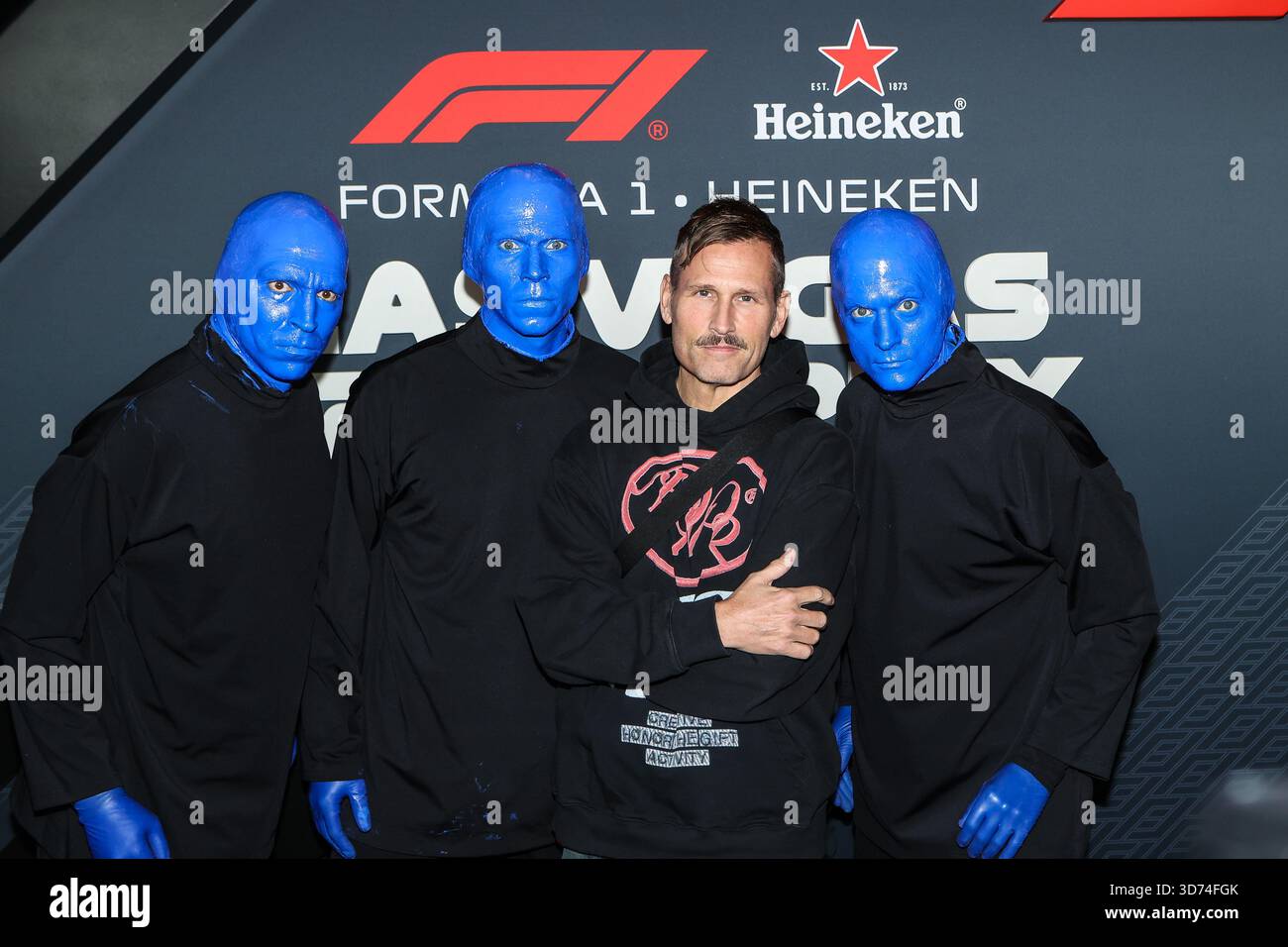 November 22, 2025: Members of the Blue Man Group pose with DJ Kaskade ...