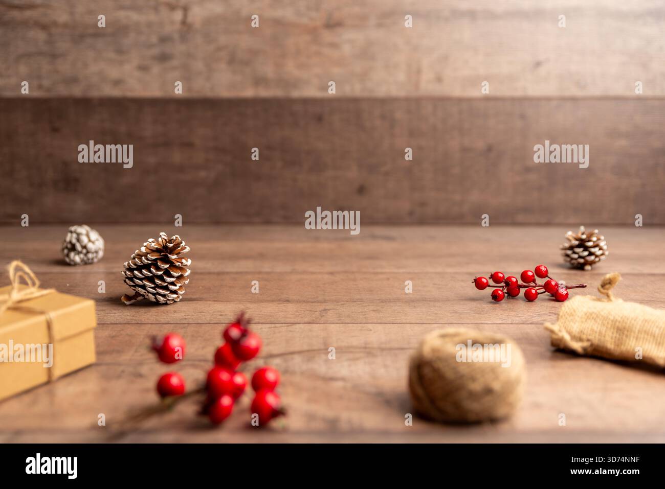 Christmas flat lay background with pinecones, berries and rustic wood surface, perfect for holiday designs, copy space layouts, winter campaigns and f Stock Photo