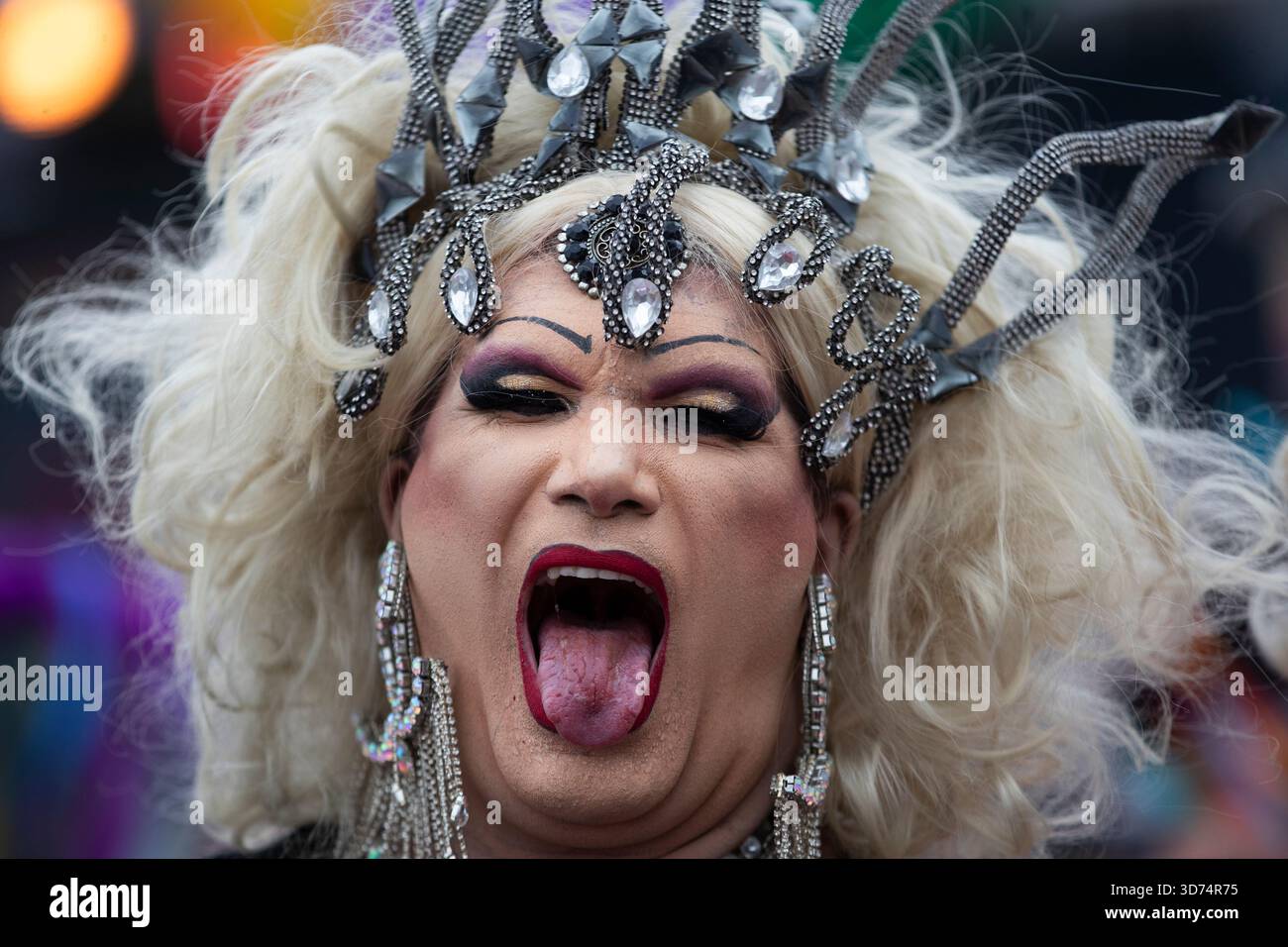 A performer makes a face during the annual Rio Pride parade along ...