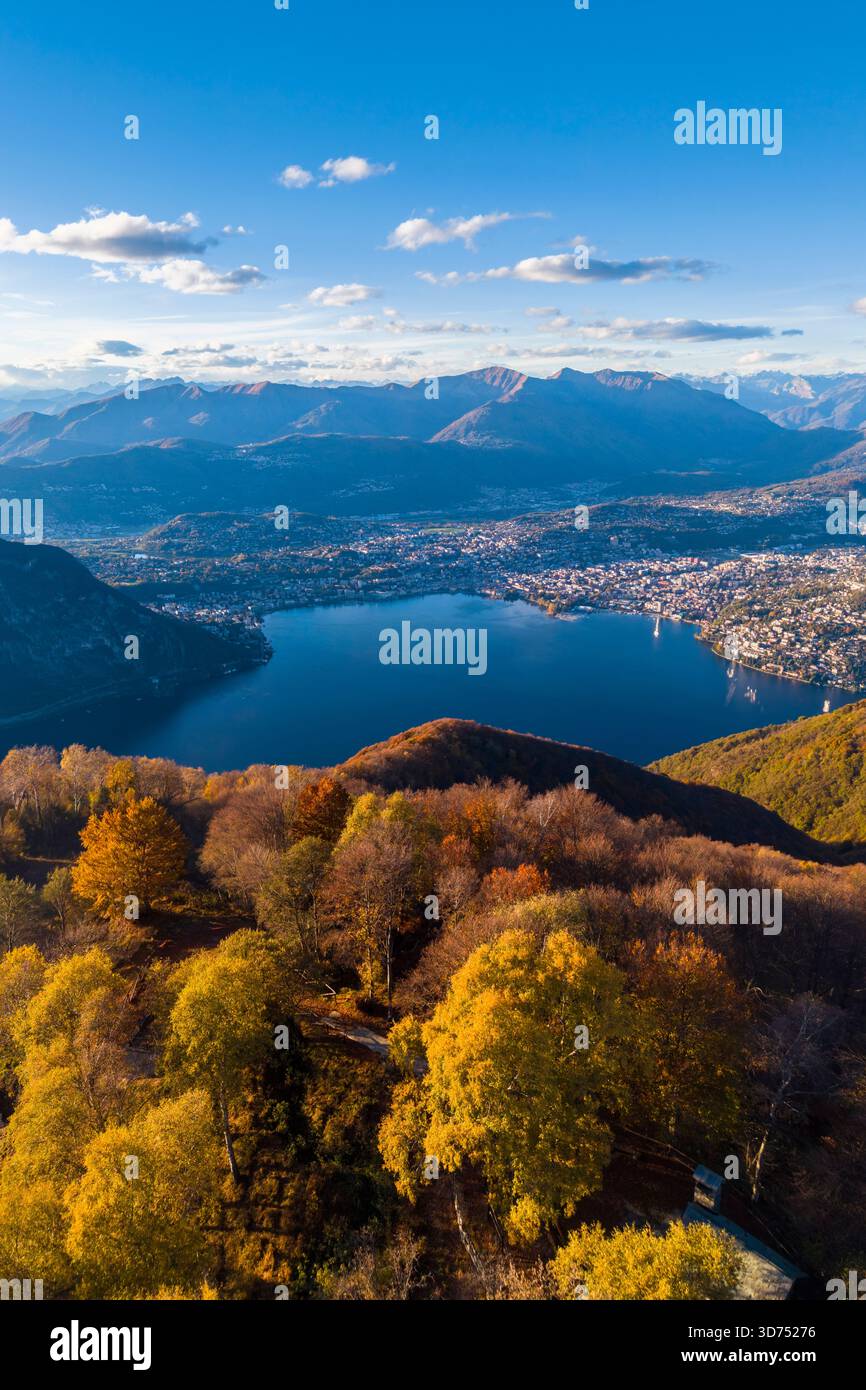 Aerial view of the autumnal panorama over Lugano city and lake in autumn from Sighignola. Lanzo d'Intelvi, Como province, Lombardy, Italy, Europe. Stock Photo