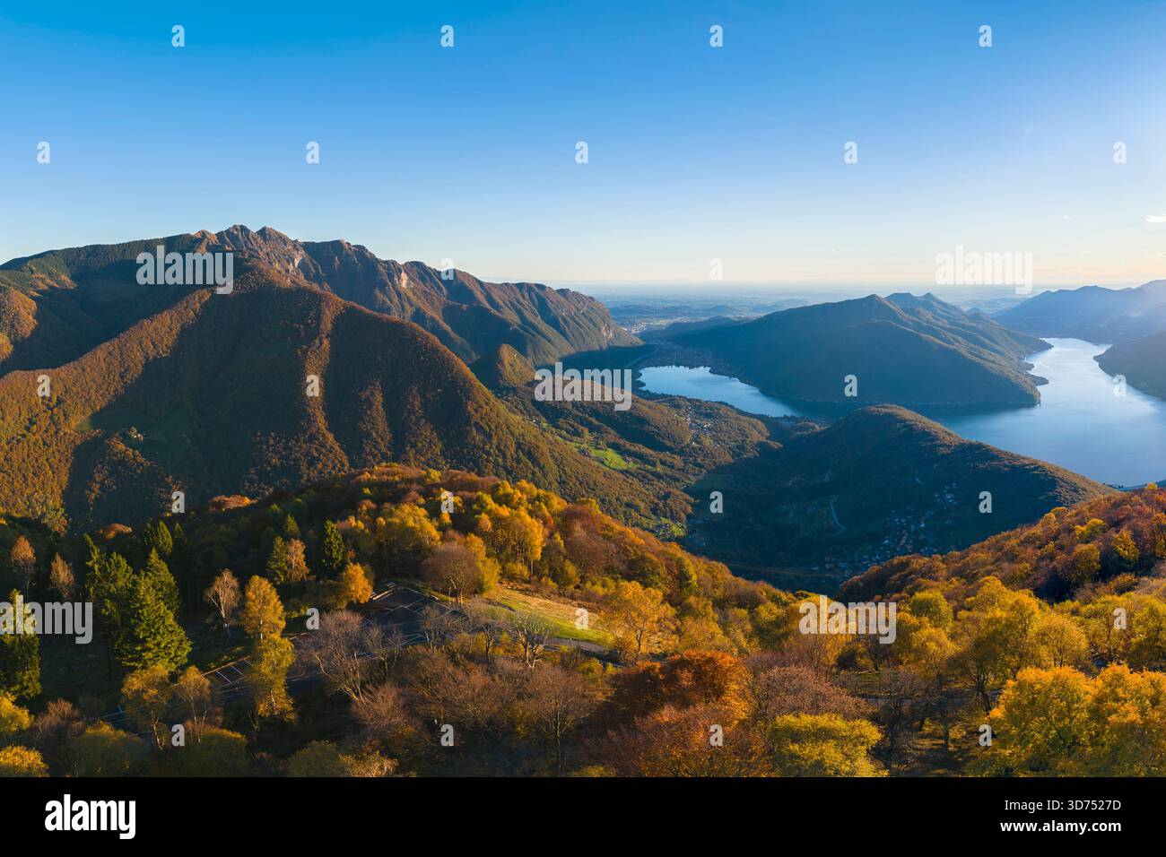 Aerial view of the autumnal panorama over Lugano city and lake in autumn from Sighignola. Lanzo d'Intelvi, Como province, Lombardy, Italy, Europe. Stock Photo