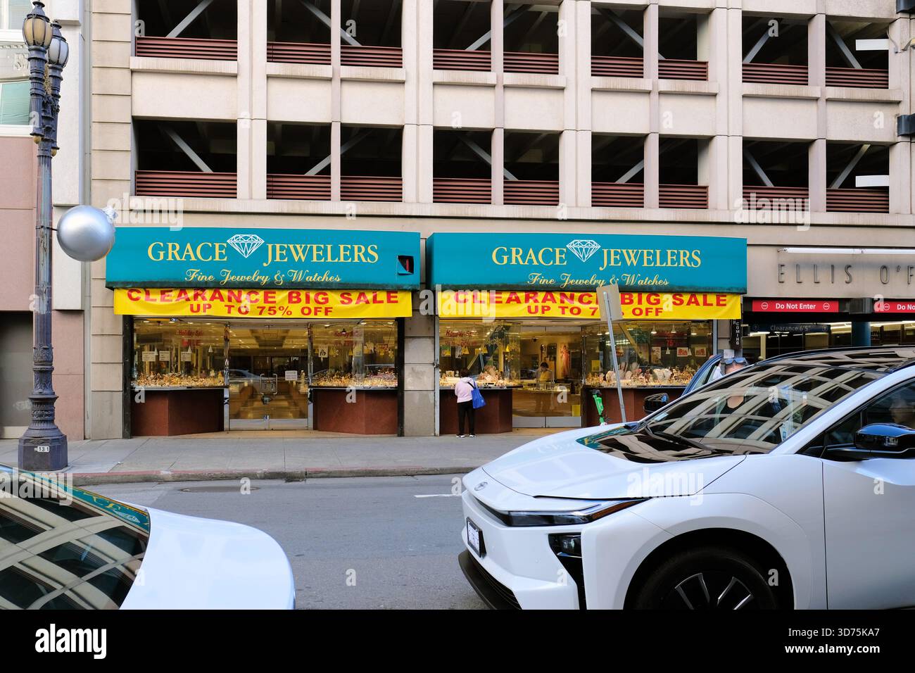 Grace Jewelry store on O'Farrell Street in downtown San Francisco, California near Union Square; yellow clearance sale banner offering up to 75% off. Stock Photo