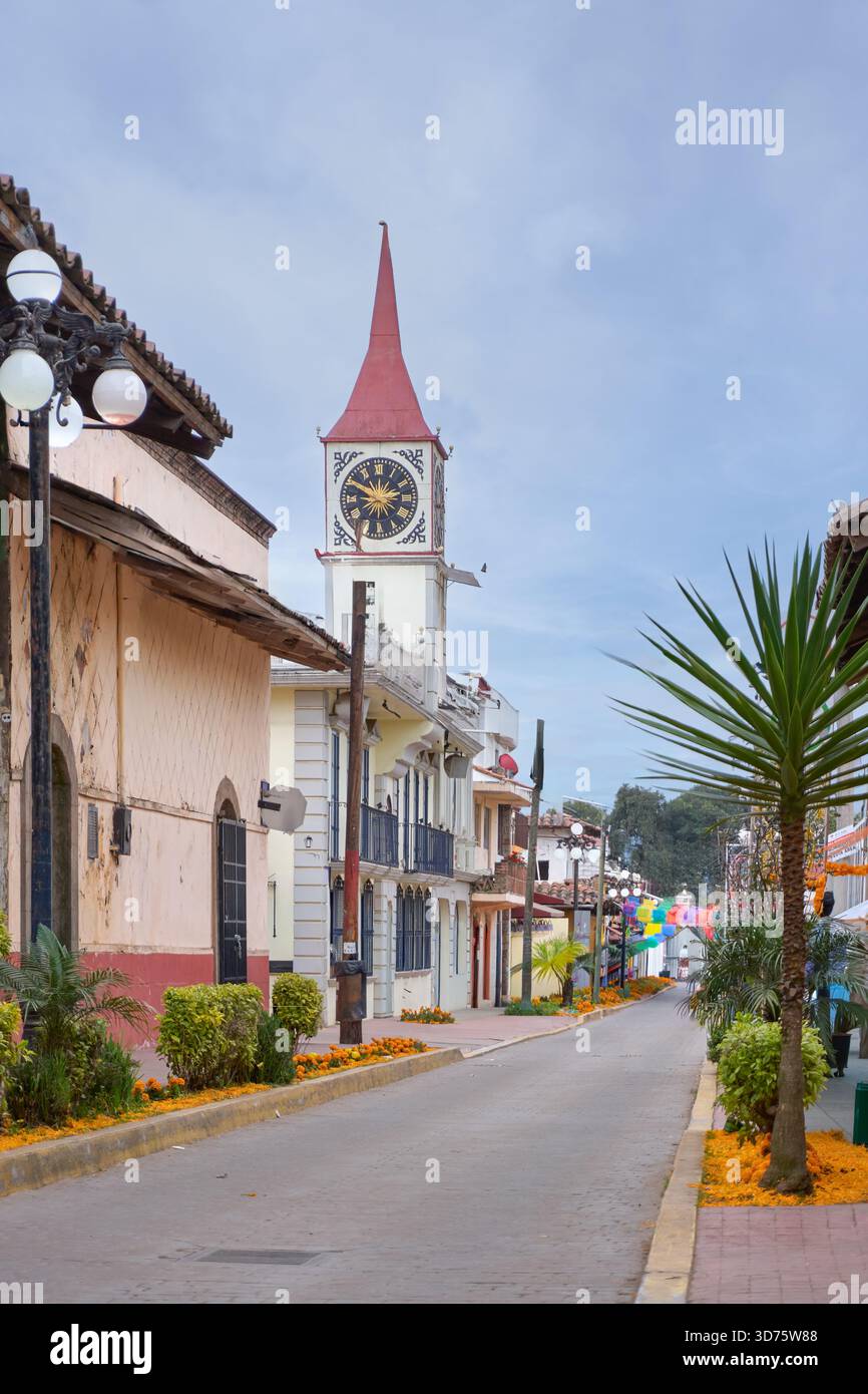 A Street With A Clock Tower And A Palm Tree The Street Is Lined With a-street-with-a-clock-tower-and-a-palm-tree-the-street-is-lined-with