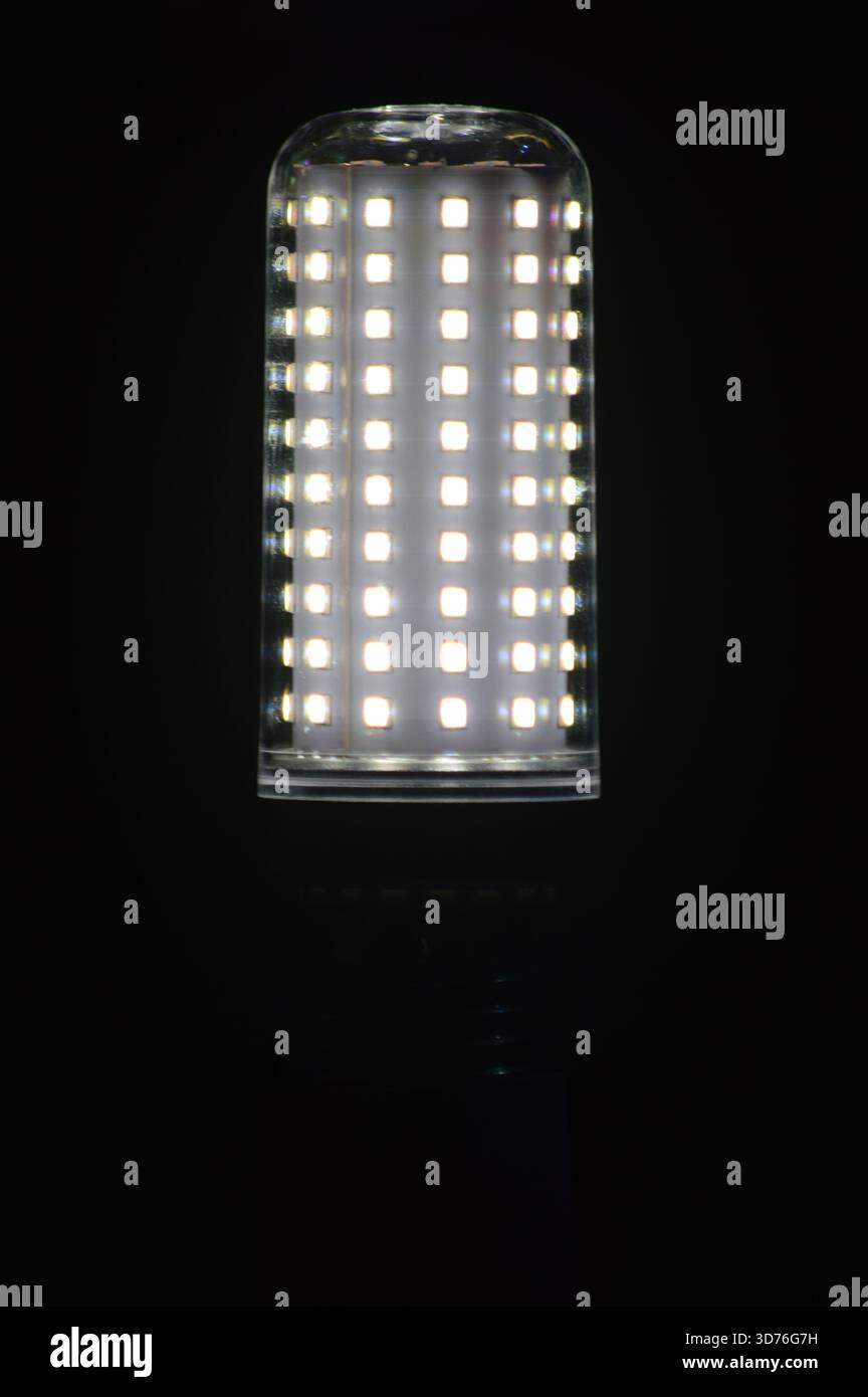 Glowing LED corn light bulb isolated on black background. Stock Photo
