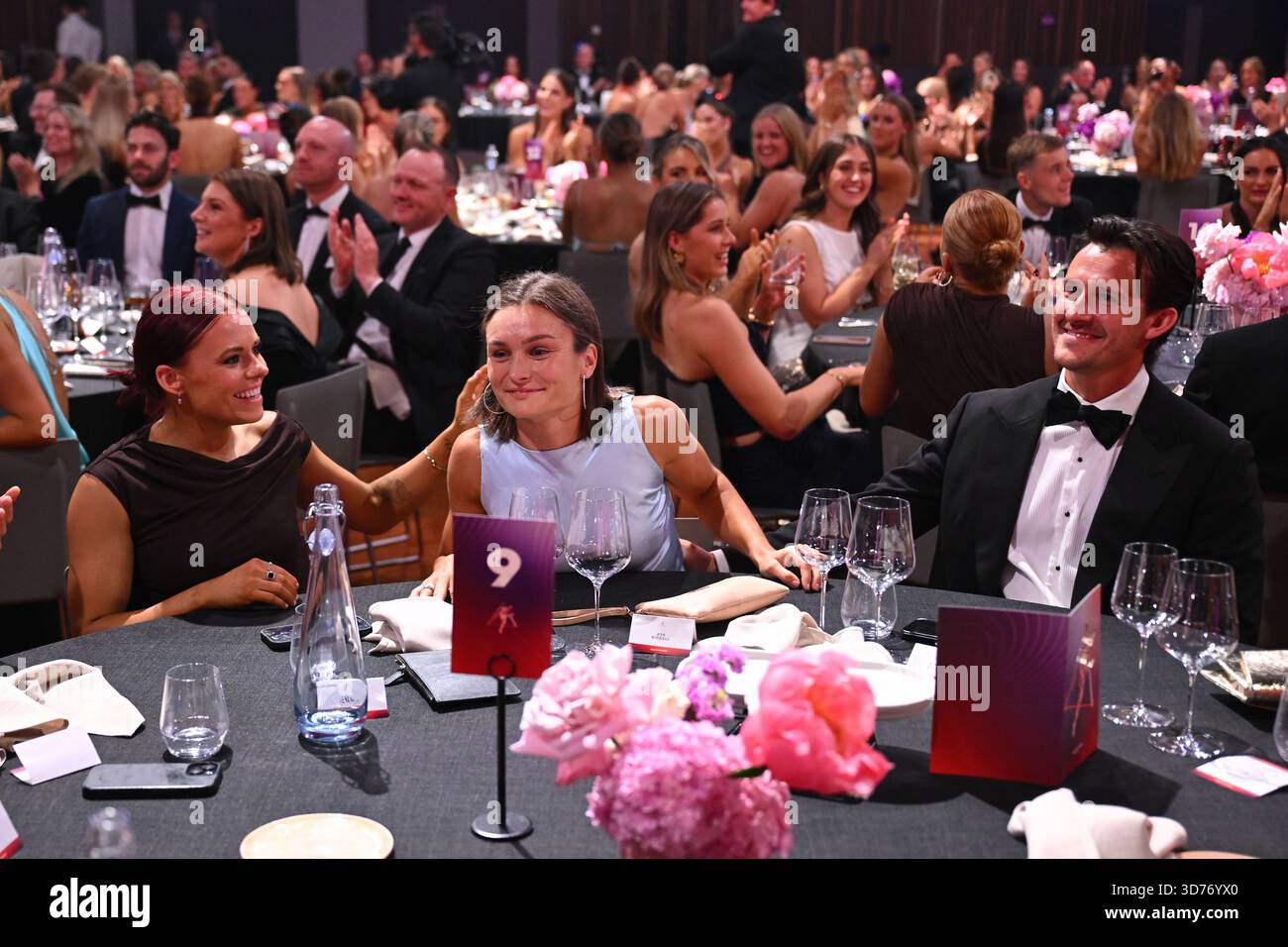 Ash Riddell of North Melbourne (centre) reacts after wining the best ...