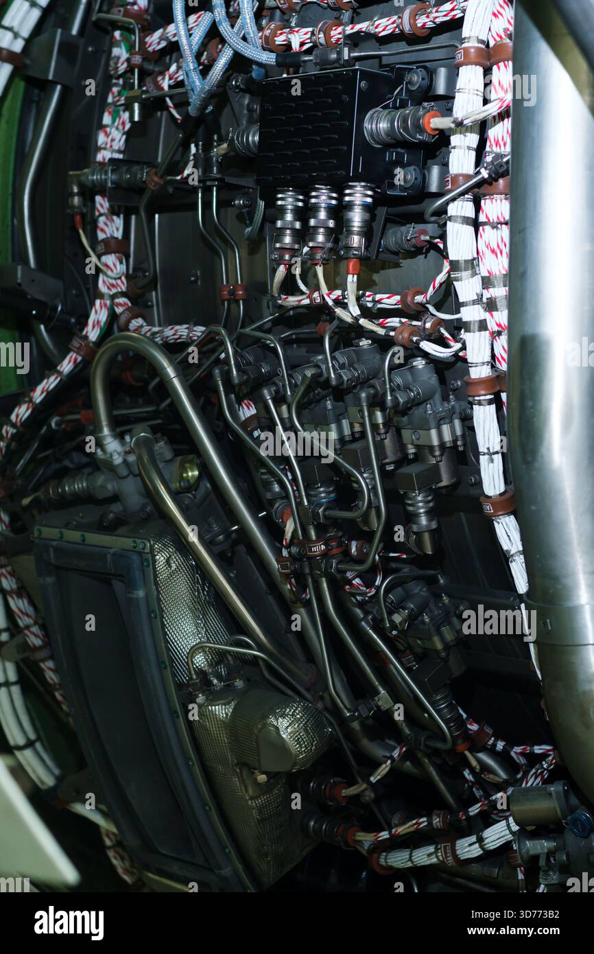 This scene reveals the intricate network of pipes and wires within an ...