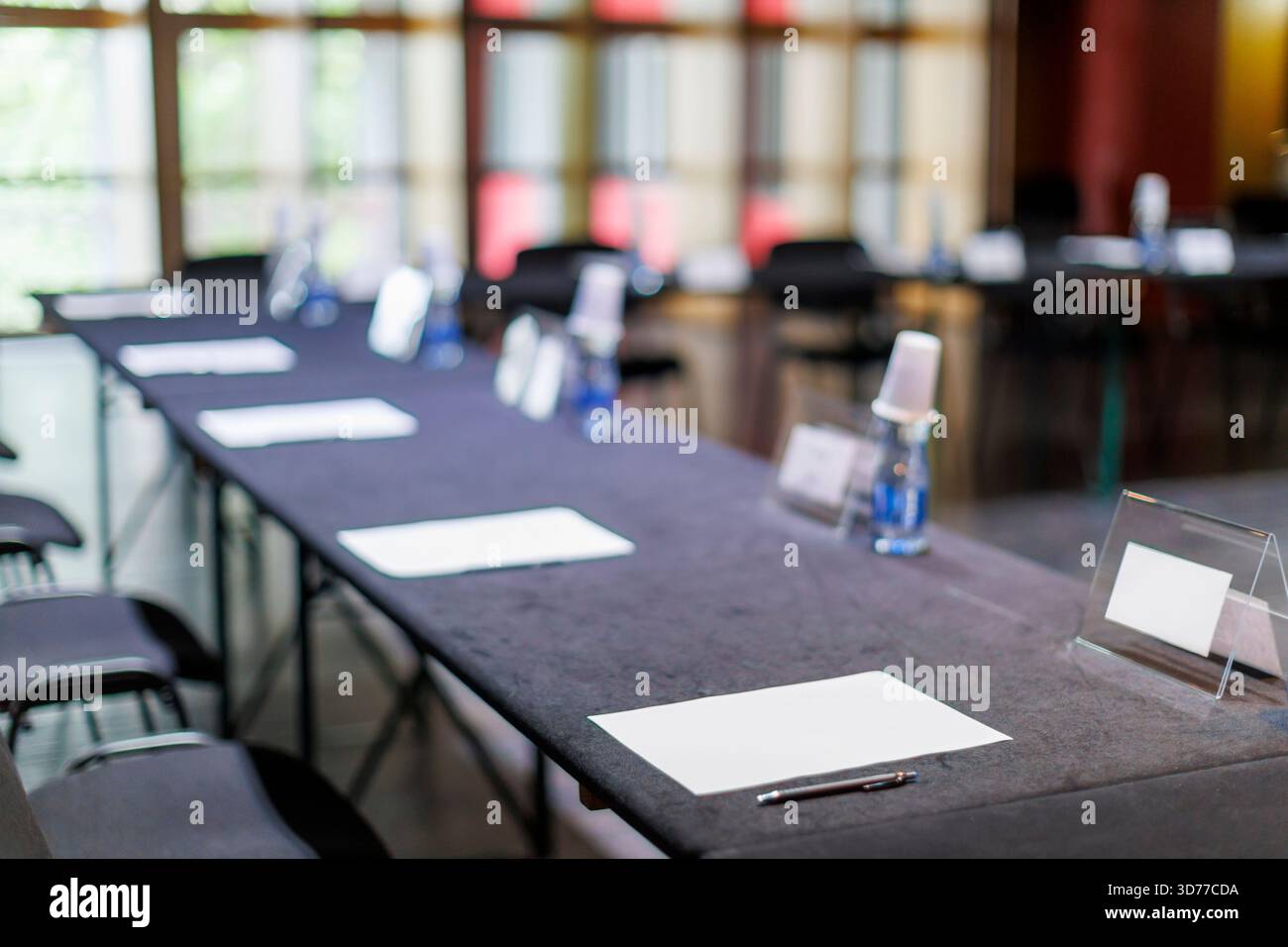 Empty conference table with papers and pens ready for a meeting Stock ...