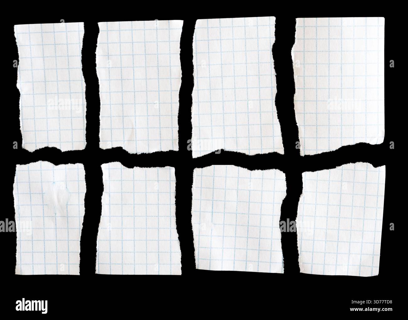 Notebook papers with torn edges on black background Stock Photo