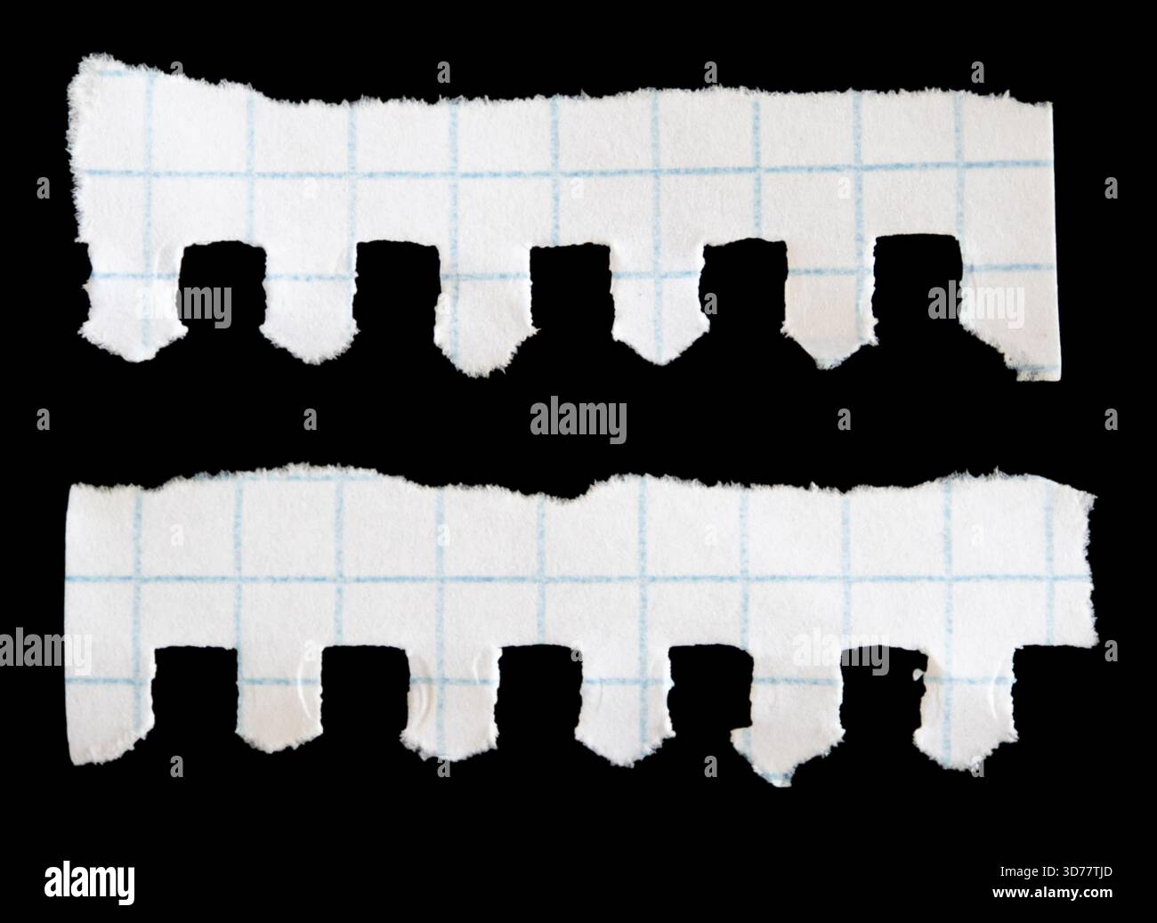 Notebook papers with torn edges on black background Stock Photo