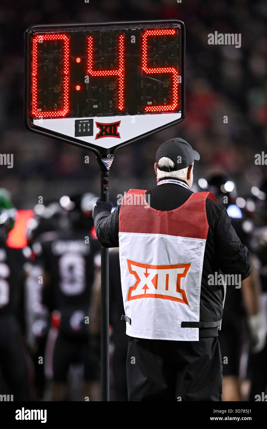CINCINNATI, OH - NOVEMBER 22: A Big 12 official holds a clock showing ...