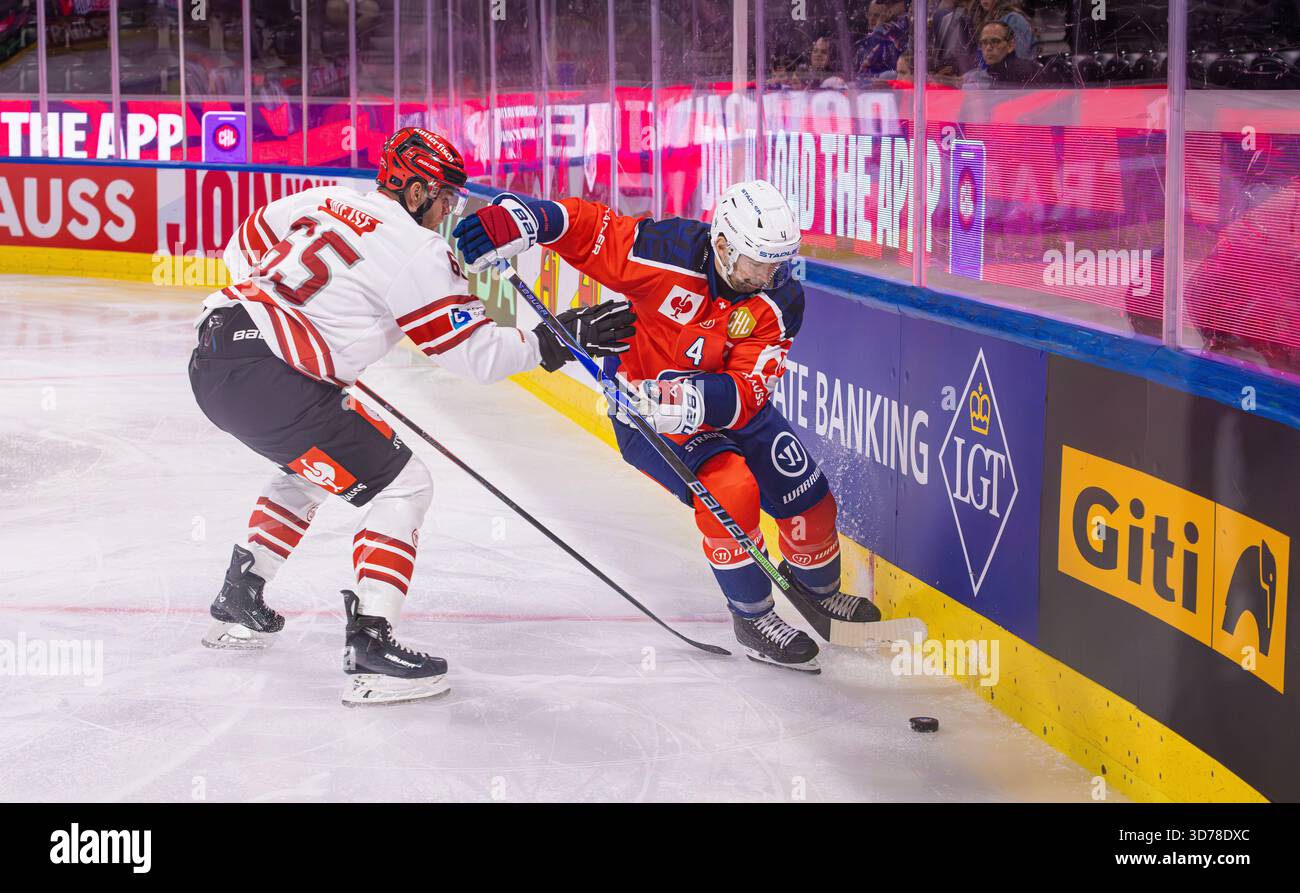 Zurich, Switzerland, 29th Aug 2025: #4 Patrick Geering (ZSC Lions) must prevail in the duel against #65 Christian Wejse (Bremerhaven). (Photo by Andre Stock Photo