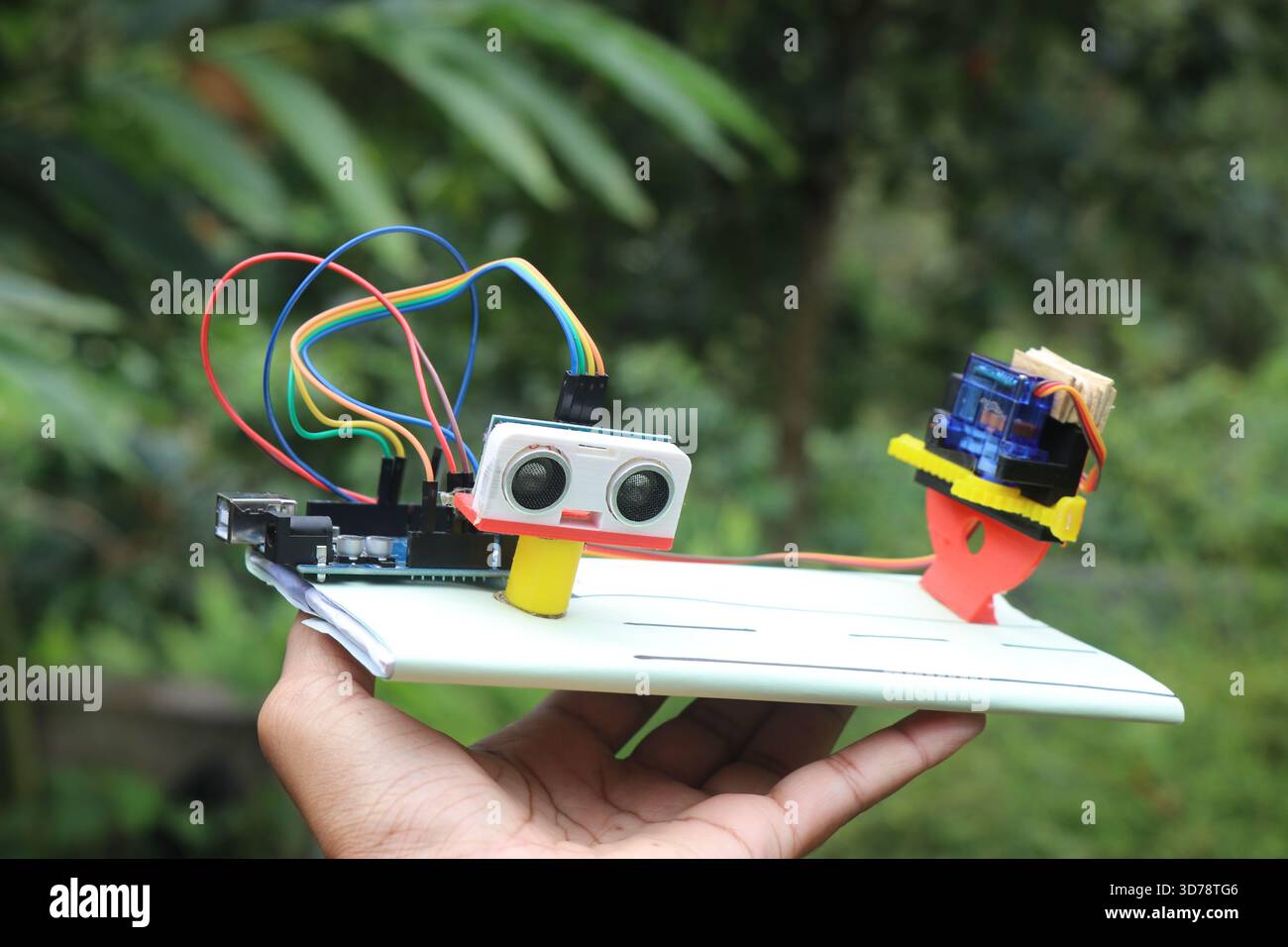 Working prototype of automatic gate system project using microcontroller that uses ulrasonic sensor and micro servo Stock Photo