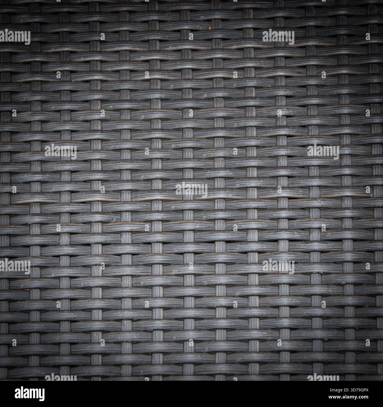 Grey basket weave pattern. Vignette. Textured Background. Stock Photo