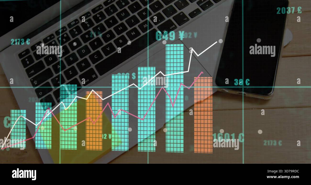 Displaying multicolored financial data visualization over work desk, with laptop and smartphone Stock Photo