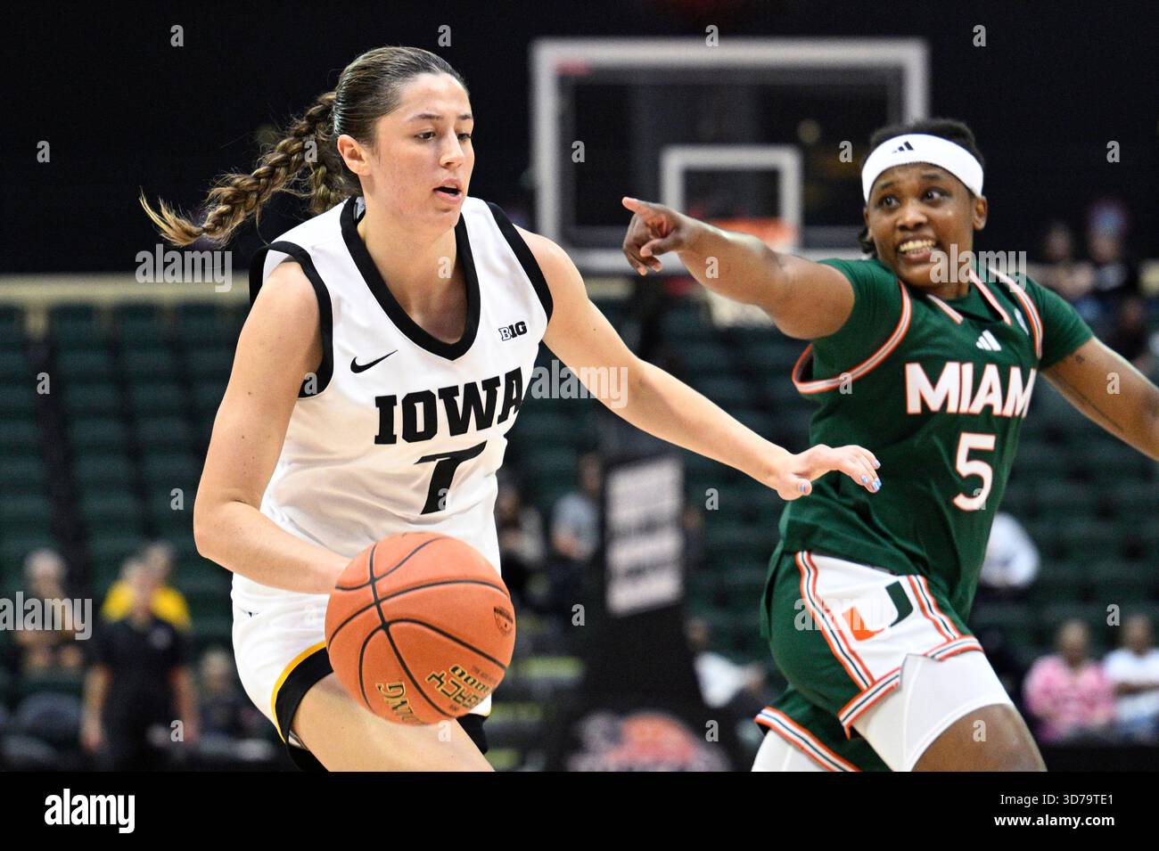 Iowa guard Addison Deal (7) drives to the basket as Miami guard Ahnay ...
