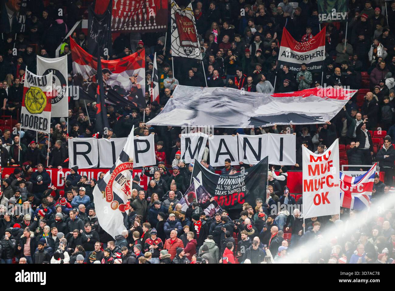RIP Mani (Stone Roses) banner held up by fans during the Manchester ...
