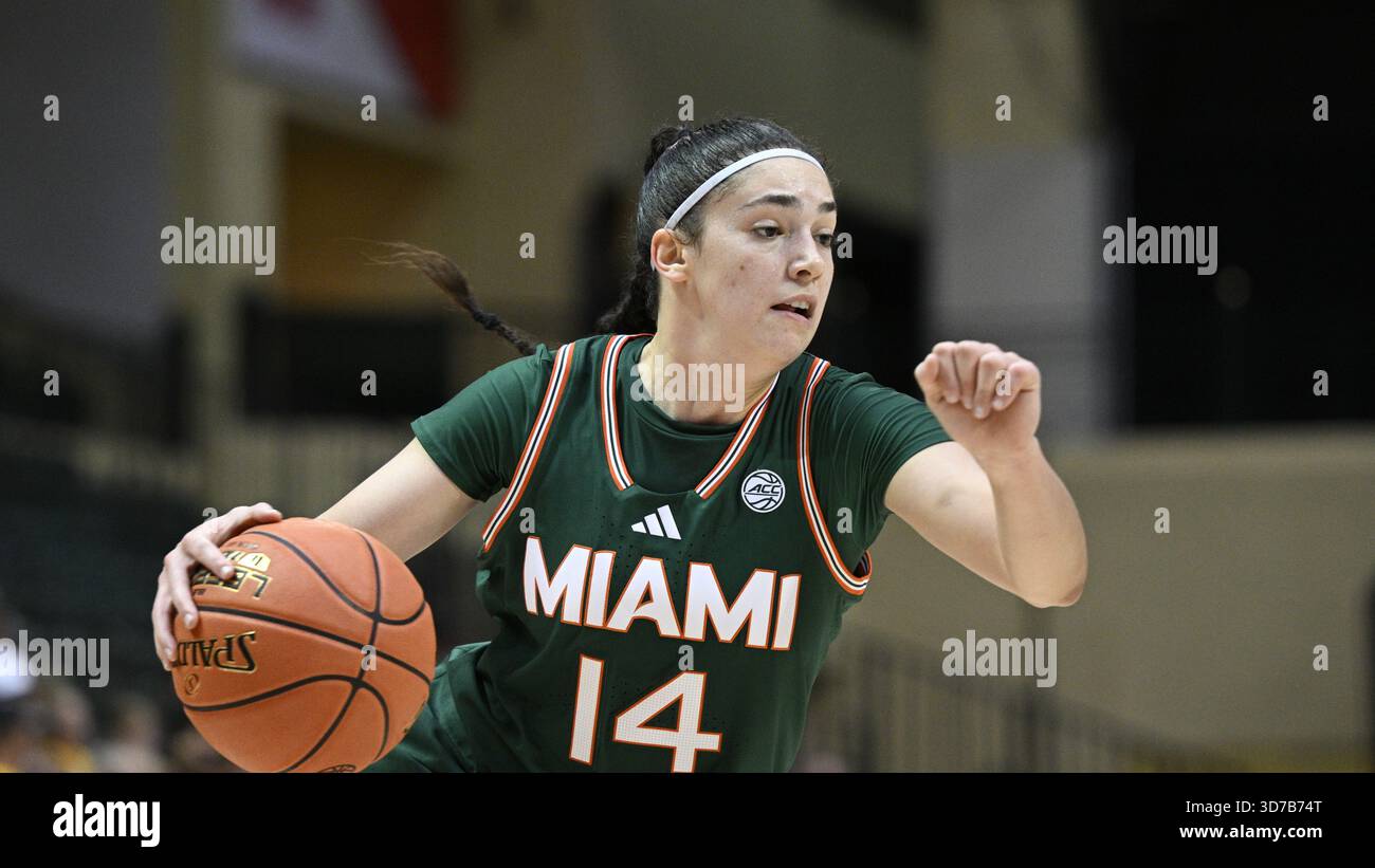 Miami guard Gal Raviv (14) drives to the basket during an NCAA college ...