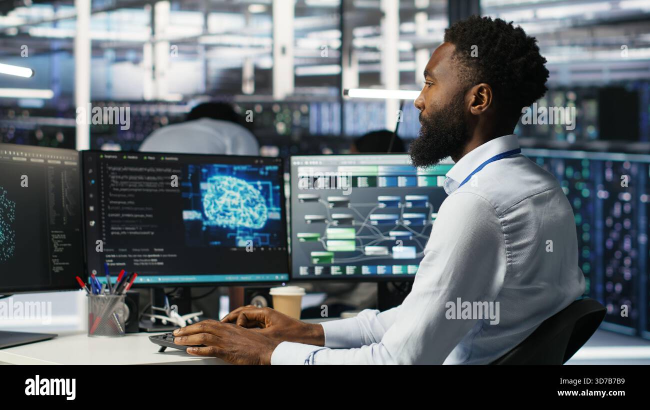 Server hub engineering team interprets AI generated data analytics graphs. Teamworking data center colleagues using artificial intelligence program showing predictive system metrics, camera B Stock Photo